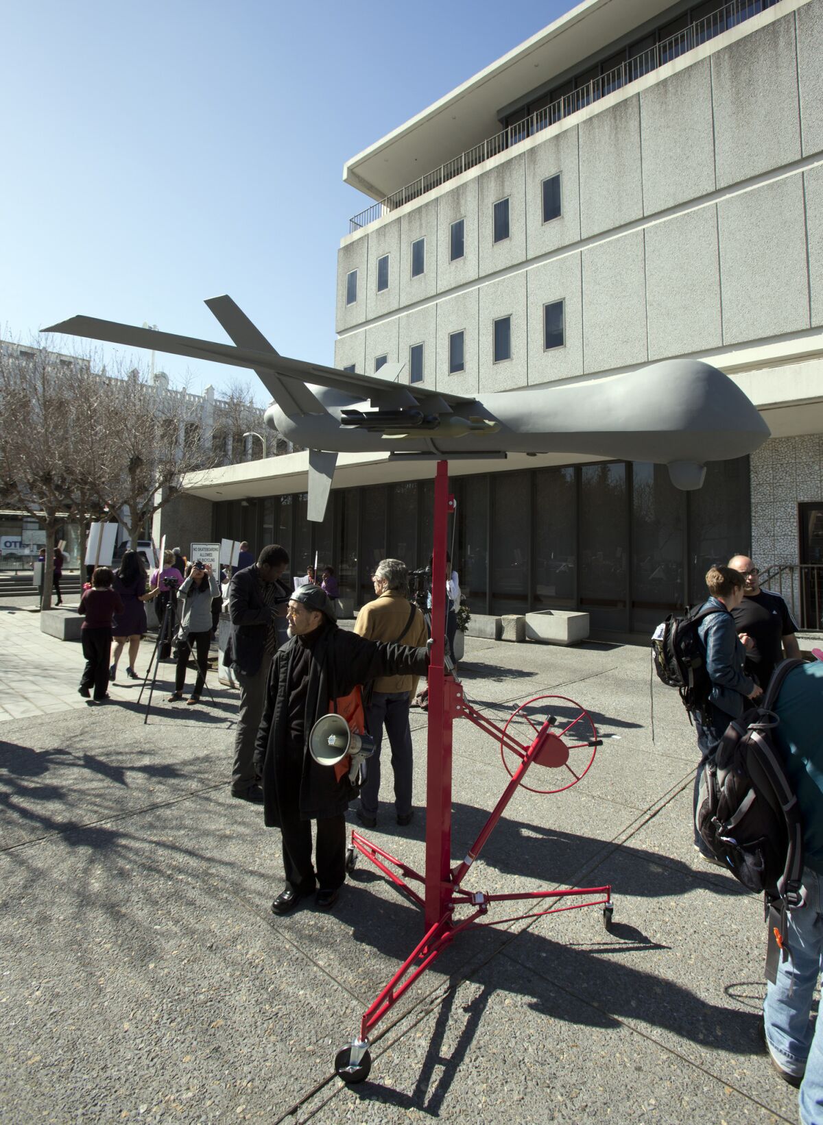 A model of a military-style drone stands outside the Alameda County Administration Building earlier this month before the start of a hearing on the Alameda County Sheriff's plan to acquire a drone for aerial enforcement.