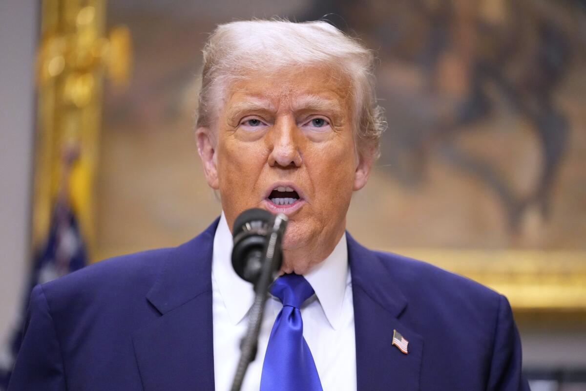 President Trump speaks at a microphone