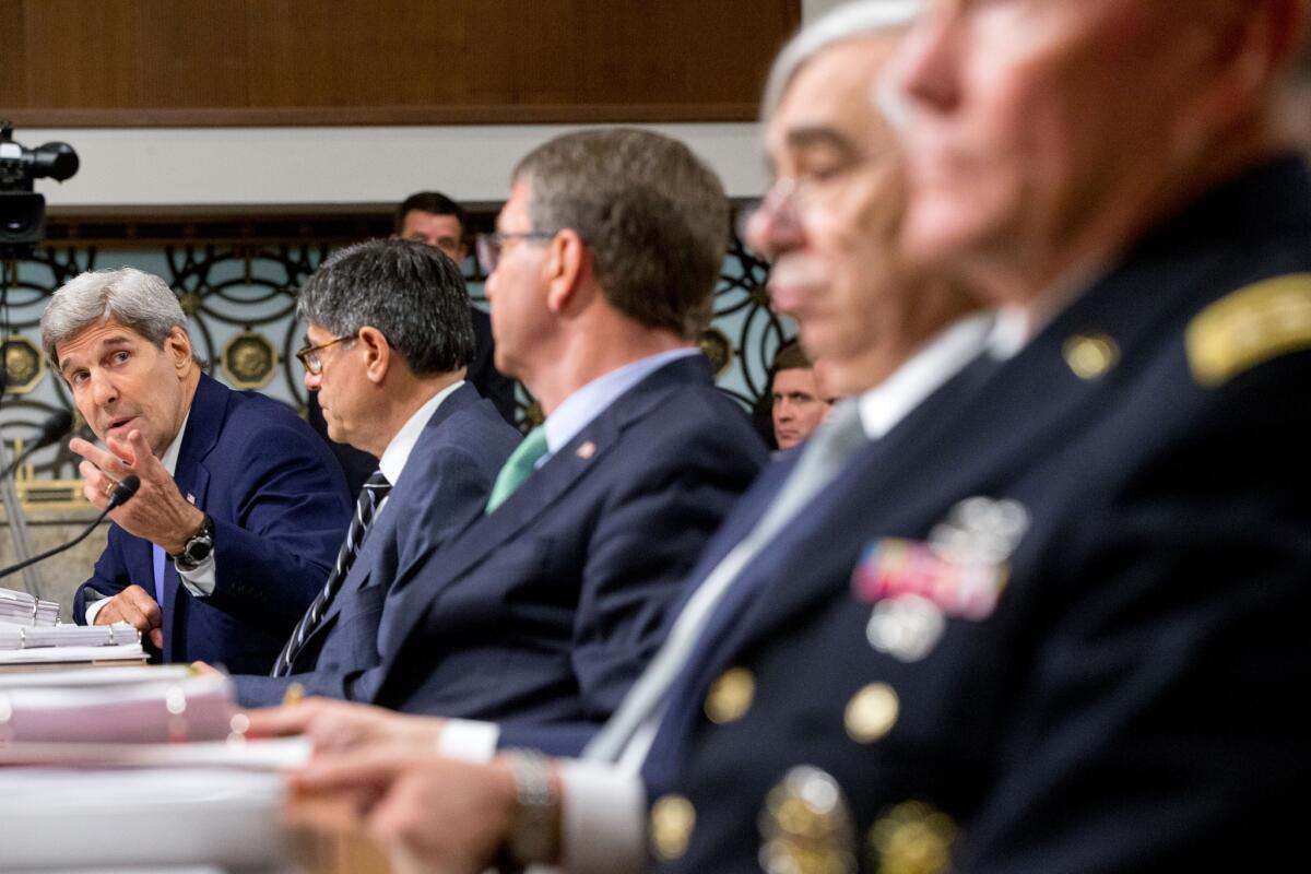Secretary of State John Kerry, left, testifies on Capitol Hill in Washington, Wednesday, July 29, before the Senate Armed Services Committee hearing, on the impacts of the Joint Comprehensive Plan of Action (JCPOA). From left are, Kerry, Treasury Secretary Jacob Lew, Defense Secretary Ash Carter, Energy Secretary Ernest Moniz, and Joint Chiefs Chairman Gen. Martin Dempsey.