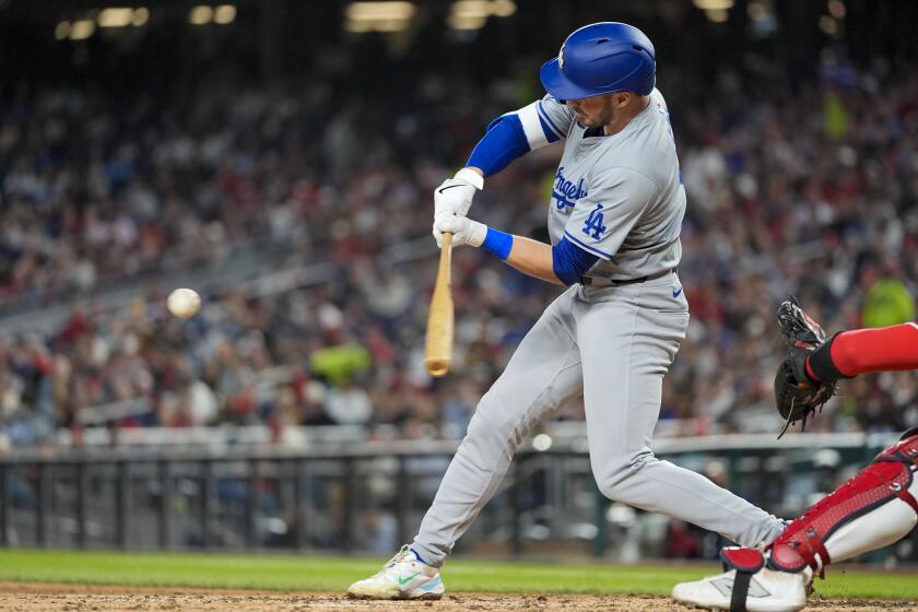 Los Angeles Dodgers' Gavin Lux hits a two-run single during the fifth inning of the team's baseball game against the Washington Nationals at Nationals Park, Wednesday, April 24, 2024, in Washington. (AP Photo/Alex Brandon)