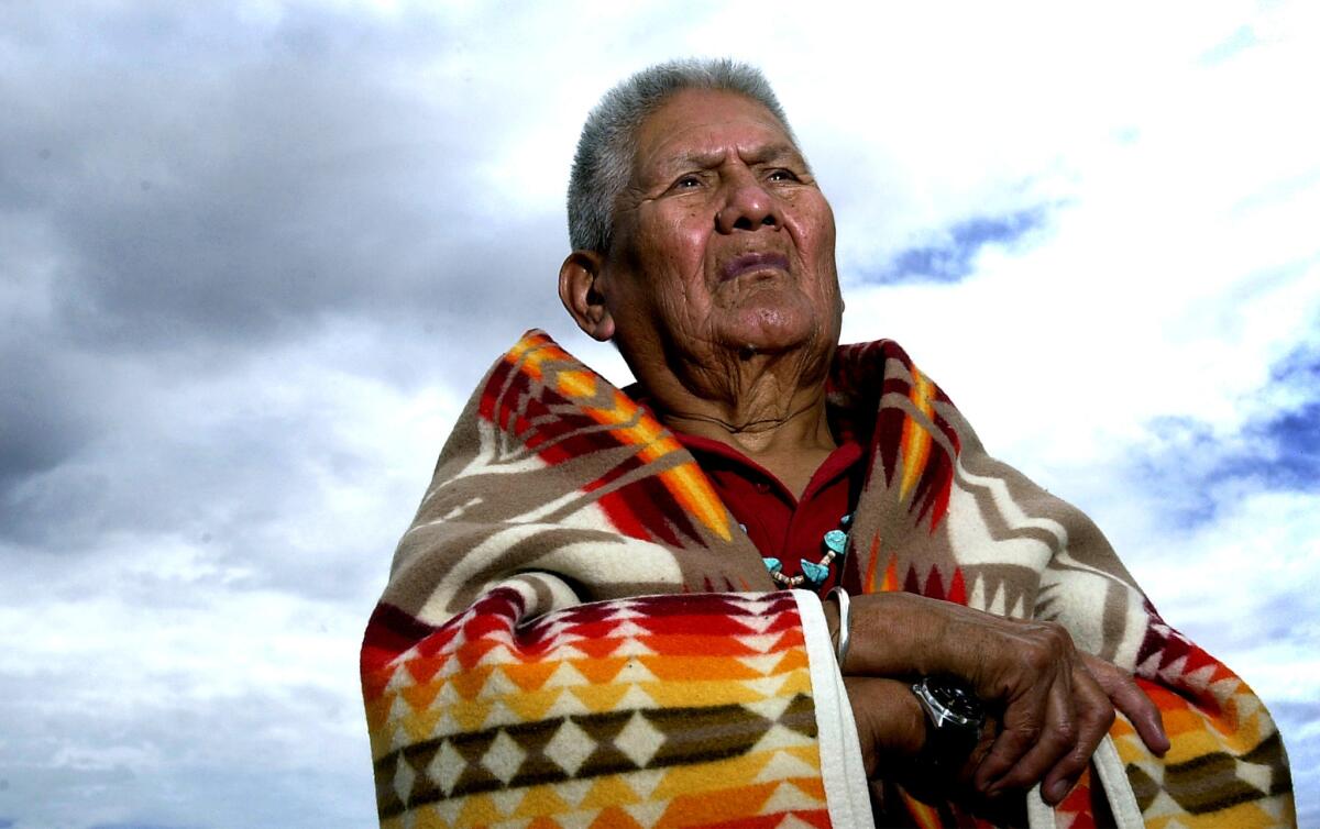 Chester Nez, the last of the Navajo code talkers, stands outside his son's home in Albuquerque in 2001.