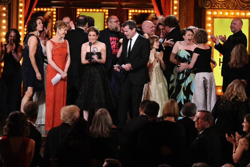 Kristin Caskey, center, along with cast and crew accepts the award for best musical for "Fun Home" during the 69th annual Tony Awards at New York's Radio City Music Hall on June 7, 2015.