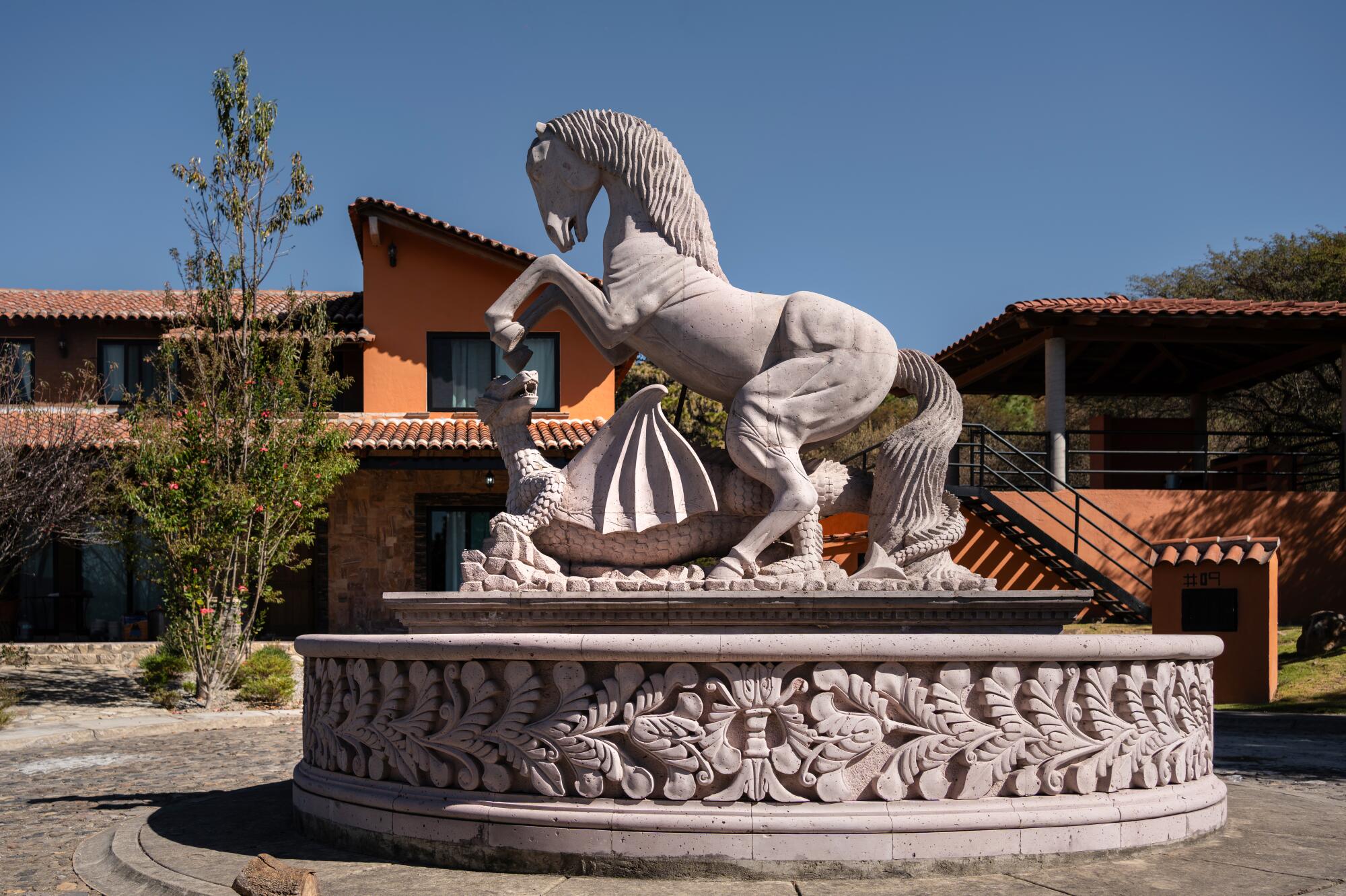 A sculpture of a horse trampling a dragon.