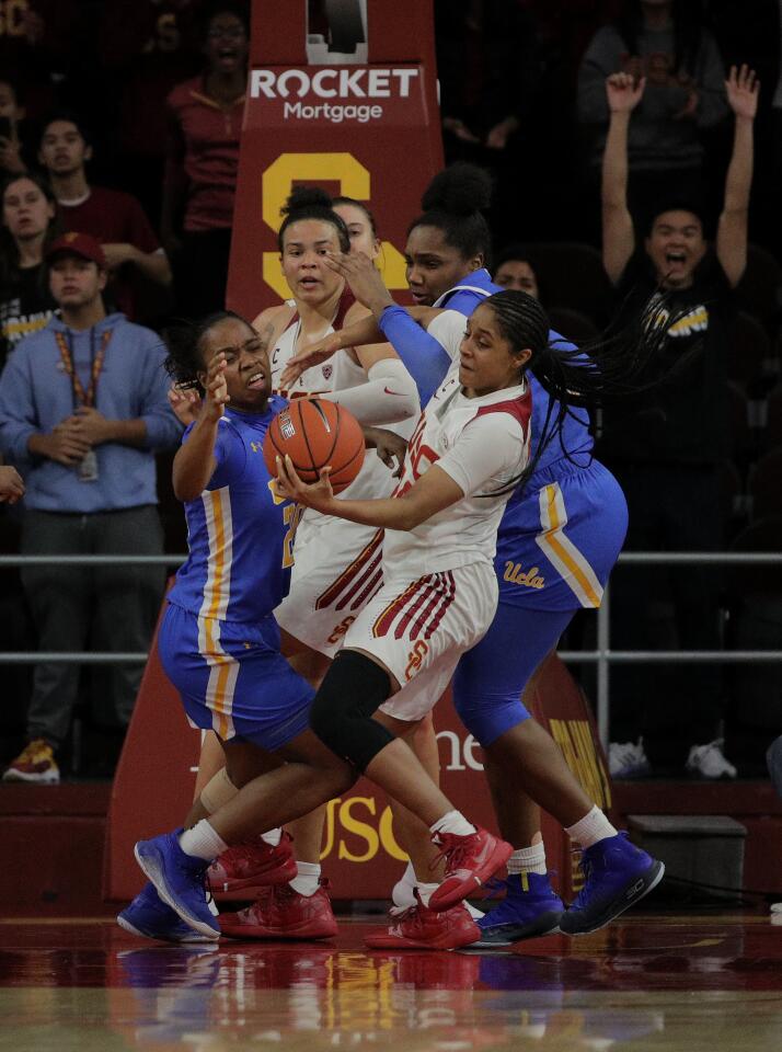 USC guard Desiree Caldwell (24) steals the ball from UCLA guard Japreece Dean (24) during the final moments of the Trojans' 70-68 double overtime win Jan. 17 at Galen Center.