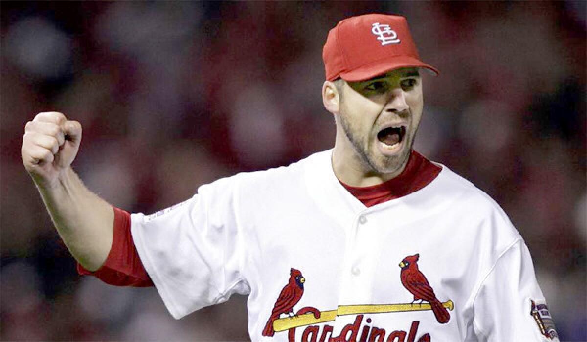 Cardinals pitcher Chris Carpenter's rehabilitation from nerve issues on the right side of his body has suffered a set back after the right-hander injured his lower back in a bullpen session.
