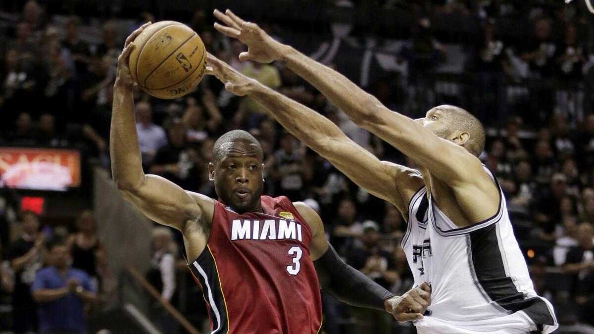 Dwyane Wade (3) and Tim Duncan will return to Miami and San Antonio, respectively, next season.