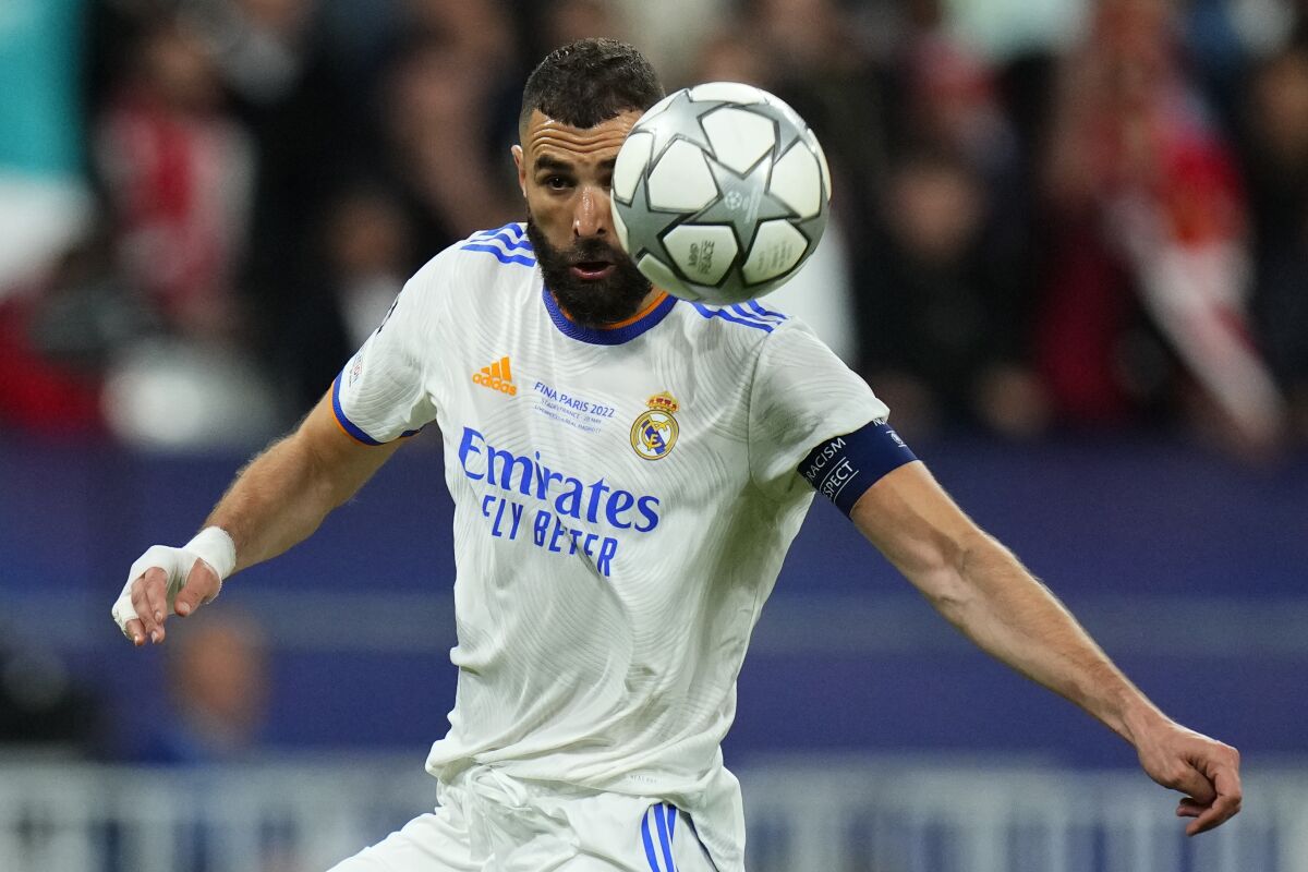 FILE - Real Madrid's Karim Benzema is in action during the Champions League final soccer match between Liverpool and Real Madrid at the Stade de France in Saint Denis near Paris, on May 28, 2022. (AP Photo/Petr David Josek, File)