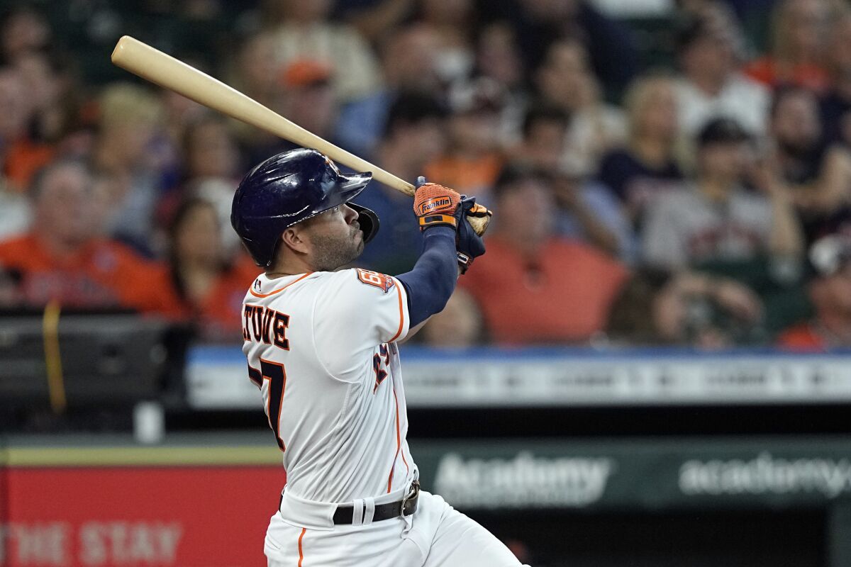 Houston Astros' Jose Altuve hits a home run against the Detroit Tigers during the third inning of a baseball game Saturday, May 7, 2022, in Houston. (AP Photo/David J. Phillip)