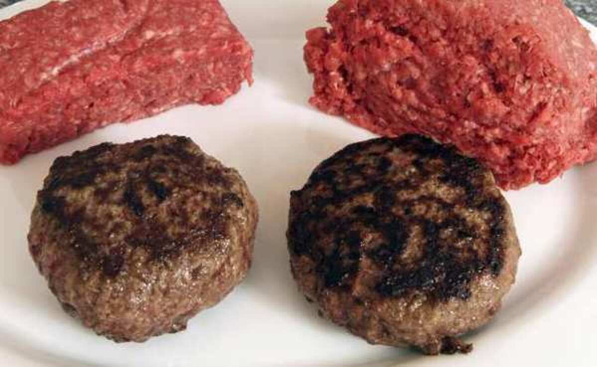 A hamburger made from ground beef containing what is derisively referred to as "pink slime," or what the meat industry calls "lean, finely textured beef," right, and one made from pure 85% lean ground beef are displayed. Beef Products Inc. says it will suspend production of the product at three of its four plants.