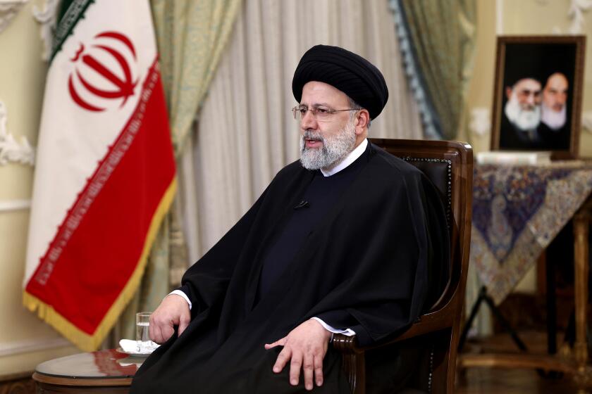 President Ebrahim Raisi speaks in a live televised interview with state-run TV, in Tehran, Iran, Tuesday, Jan. 25, 2022. 