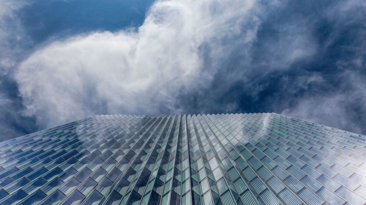 Angled windows reflect clouds passing over the new federal courthouse in downtown Los Angeles.