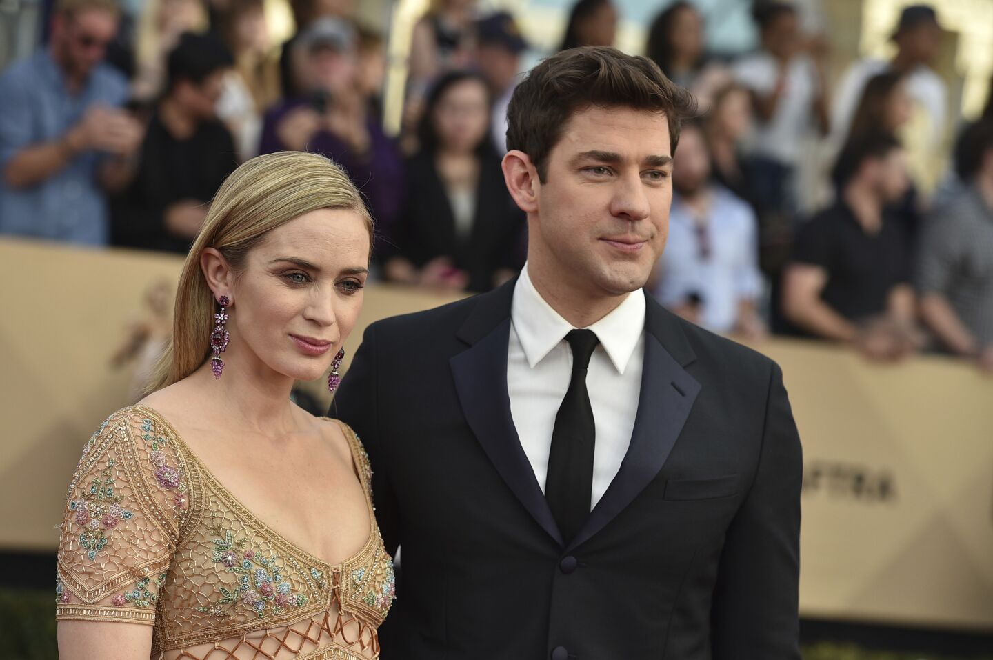 Emily Blunt, left, with husband John Krasinski, is a nominee for "The Girl on the Train."