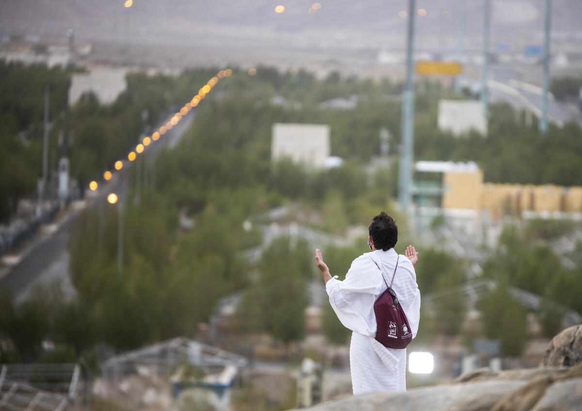 Muslim pilgrims pray near the holy city of Mecca