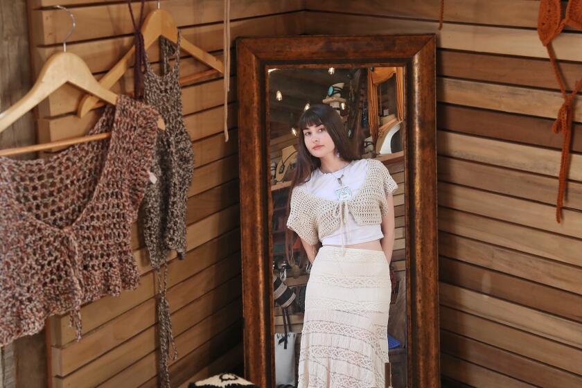 Claire Hynes, a clothing artist, displays her work at the 2024 Sawdust Summer Art Festival.