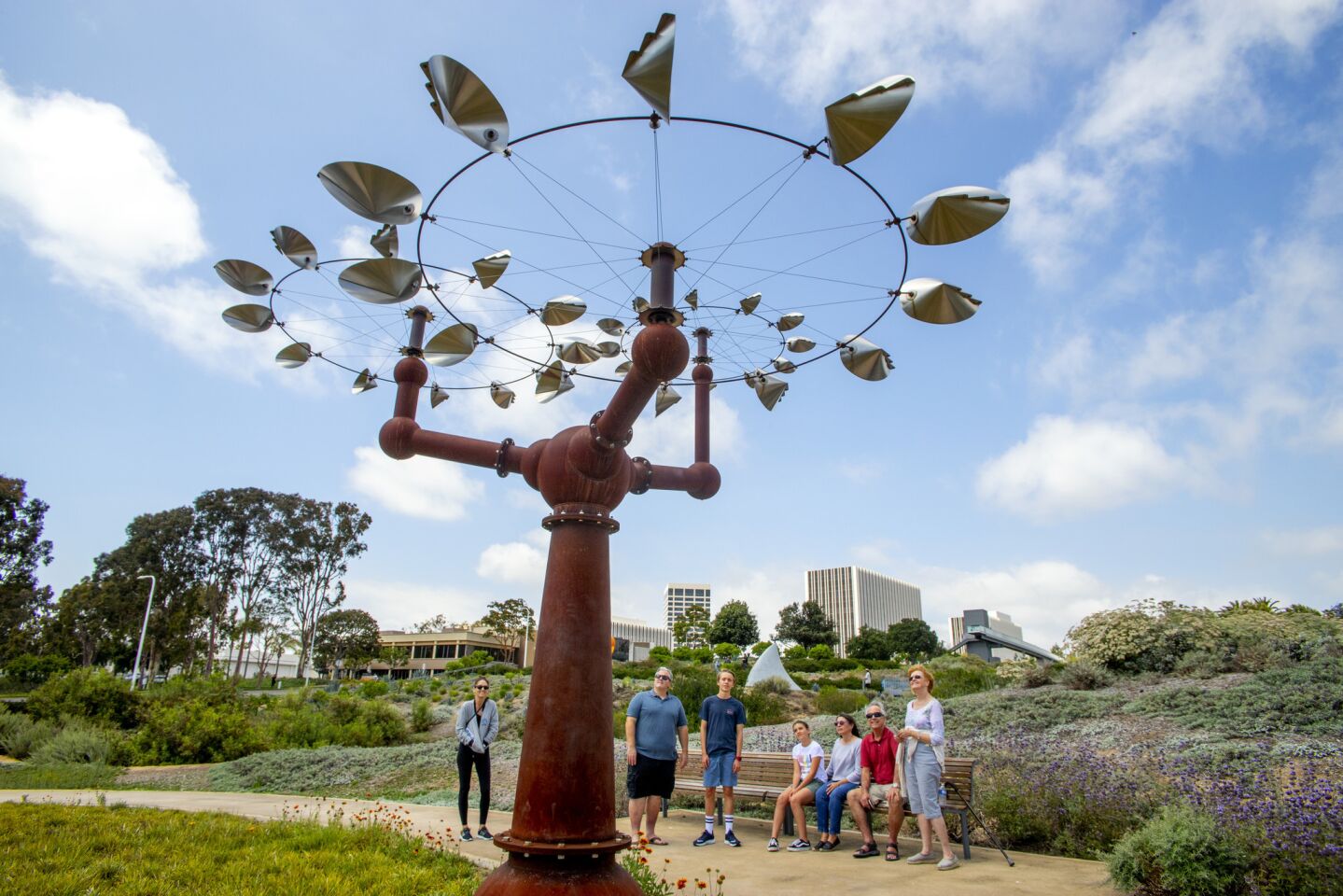 "Getting Your Bearings" by David Boyer draws an interested crowd at Newport Beach’s Civic Center Park on Saturday.