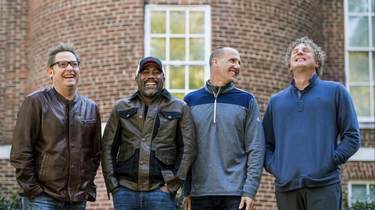 Dean Felber, left, Darius Rucker, Jim Sonefeld and Mark Bryan of Hootie & the Blowfish. The band is returning with a tour and album 25 years after Cracked Rear View launched the South Carolina-based rock band.