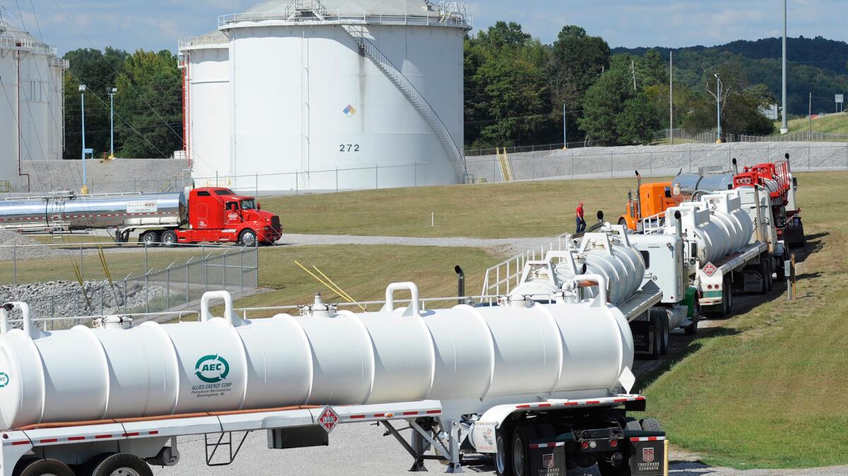Tanker trucks line up at a Colonial Pipeline Co. facility in Pelham, Ala., near the scene of a gasoline spill on Sept. 16