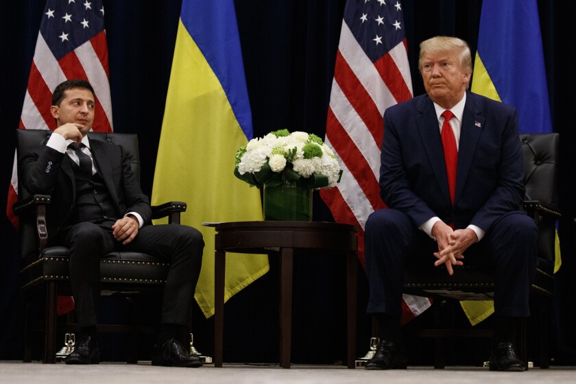 President Trump, shown with Ukrainian President Volodymyr Zelensky in September 2019 in New York, says he may end the practice of having other administration officials listen in on calls with foreign leaders after his impeachment was triggered by a July phone call with Zelensky.