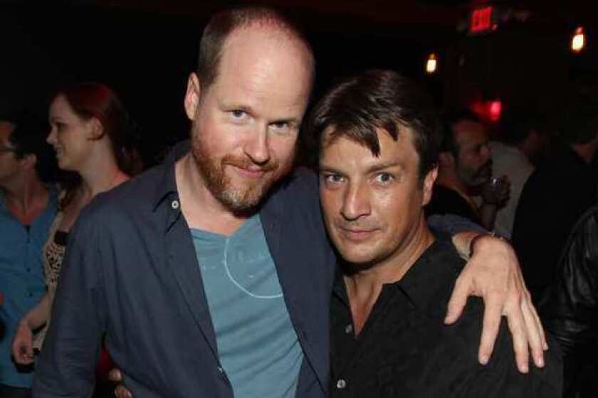 Joss Whedon, left, and Nathan Fillion at a party during Comic-Con in San Diego.