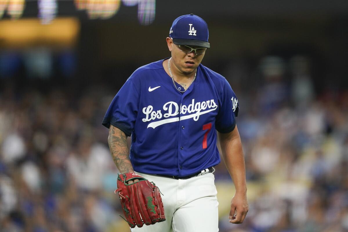 Dodgers starting pitcher Julio Urías heads to the dugout during a game against the Marlins on Aug. 19 at Dodger Stadium.