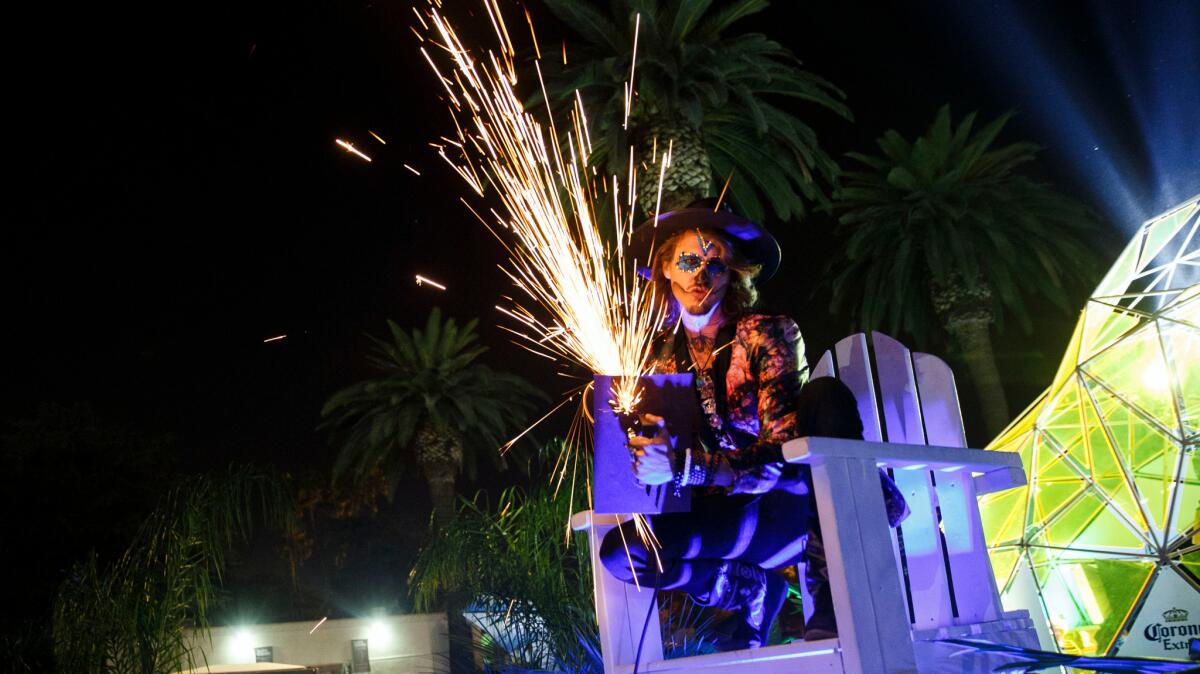 Hard Day of the Dead will not be held in 2016, organizers confirmed. In this file photo, Kahill Head uses a grinder to make sparks as music fans attend the Halloween-themed rave at the Pomona Fairplex on Oct. 31, 2015.