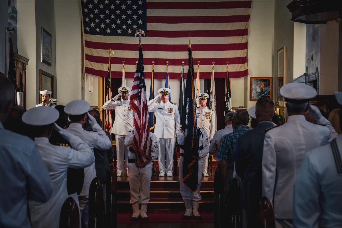 Capt. Timothy Tinker (center) at his retirement event at the Veterans Museum and Memorial Center in Balboa Park.