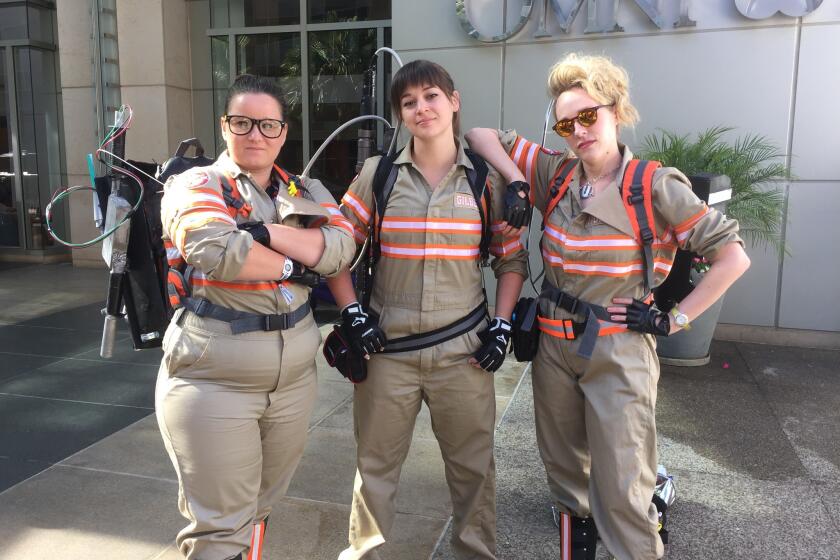 Three fans of the new "Ghostbusters" movie, captured Friday at Comic-Con in San Diego.