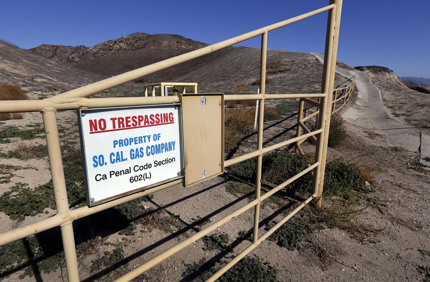 Signs and gates on the Porter Ranch hillsides indicate the boundary of Southern California Gas Co., where an ongoing gas leak has prompted hundreds of complaints.