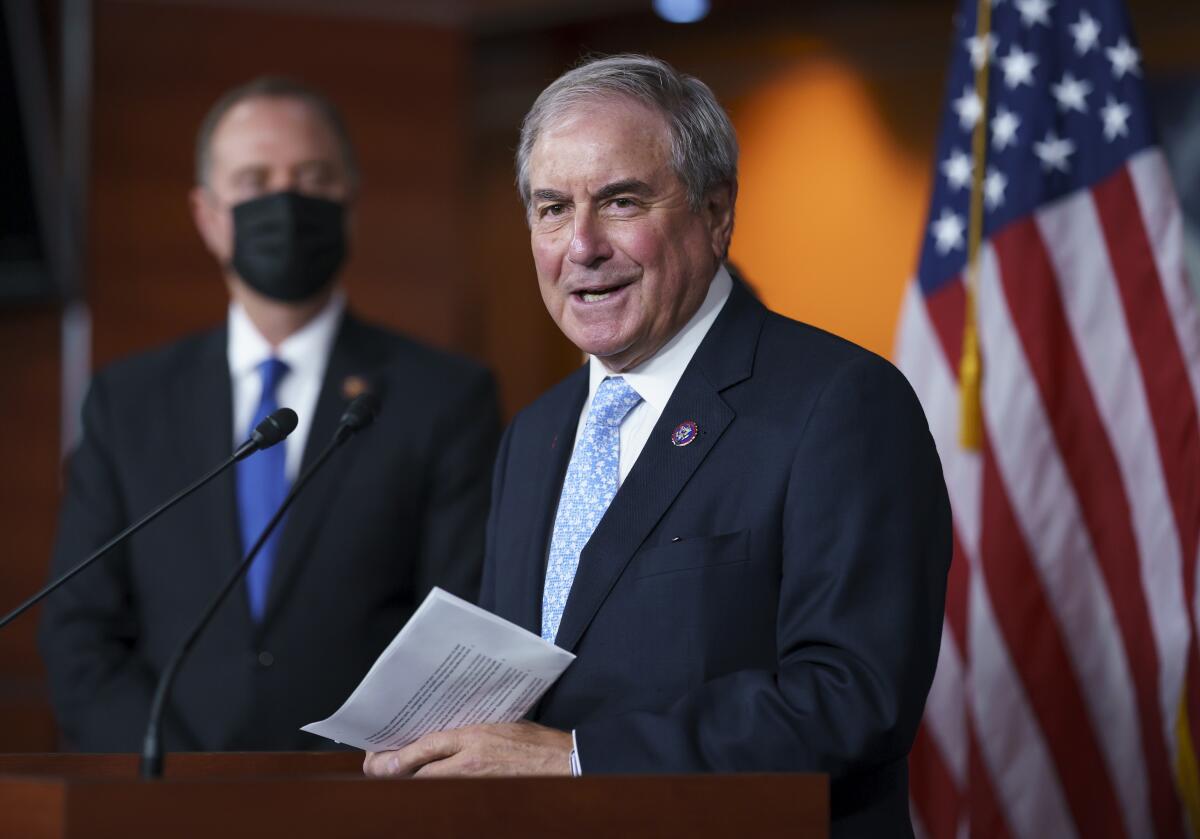 House Budget Committee Chair John Yarmuth, joined by House Intelligence Committee Chairman Adam Schiff, talks at a lectern