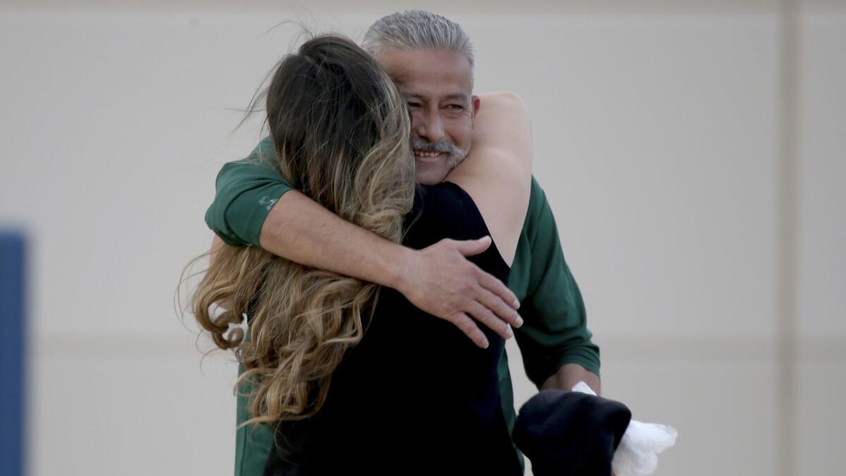 Romulo Avelica-Gonzalez embraces daughter Brenda after being released from the Adelanto Detention Facility.