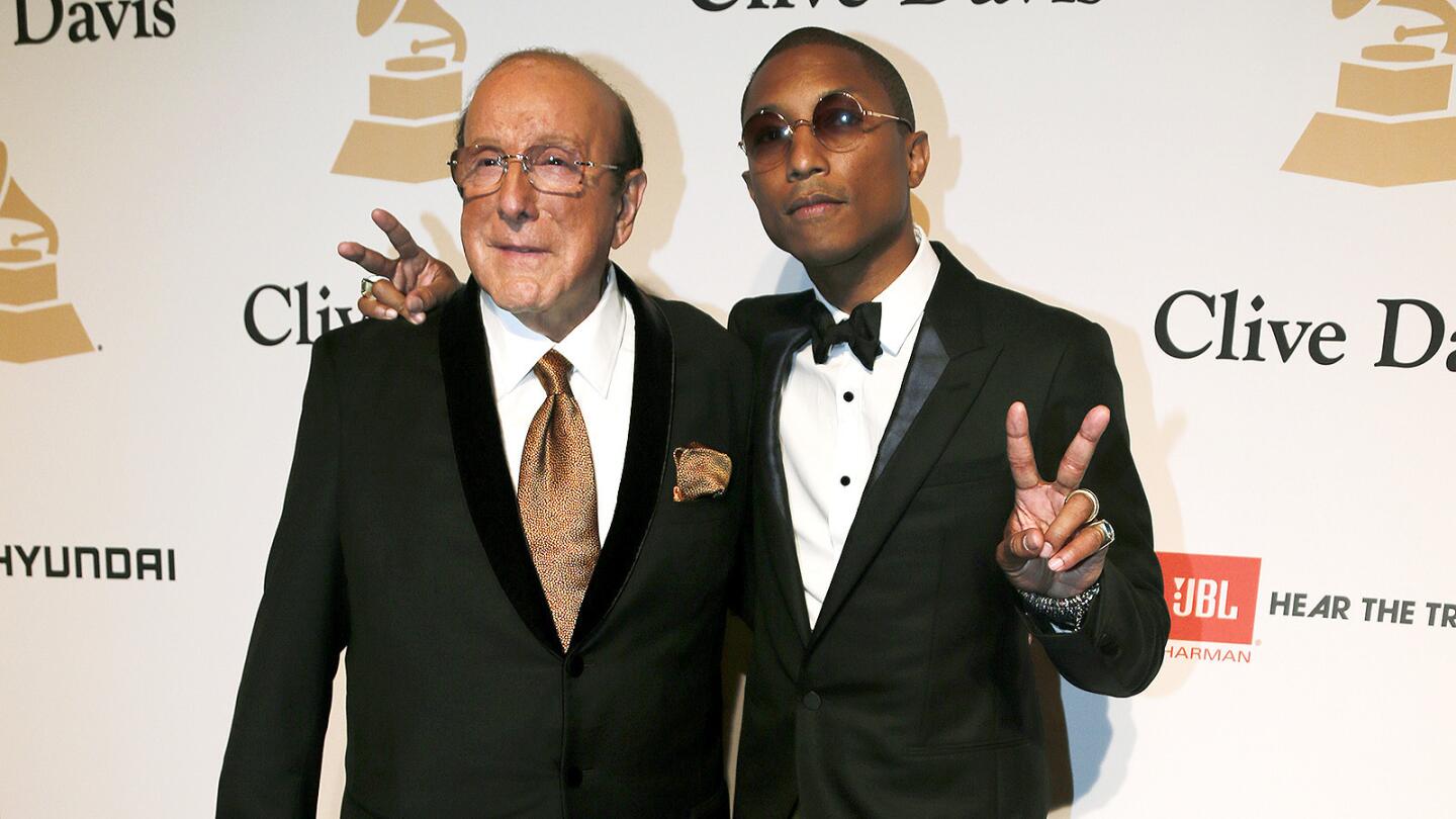 Pharrell Williams, right, joins Clive Davis on the red carpet for the Pre-Grammy Gala and Salute to Industry Icons at the Beverly Hilton on February 7, 2015 in Beverly Hills. MORE: More: Show highlights | Quotes | Backstage