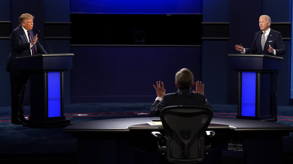 Moderator Chris Wallace speaks as President Trump and  Joe Biden speak during the first presidential debate 