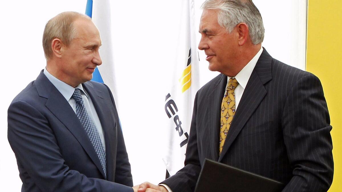 Russian President Vladimir Putin and Exxon Mobil CEO Rex Tillerson shake hands at a ceremony celebrating the signing of an agreement between state-controlled Russian oil company Rosneft and Exxon Mobil, in Russia in 2012.