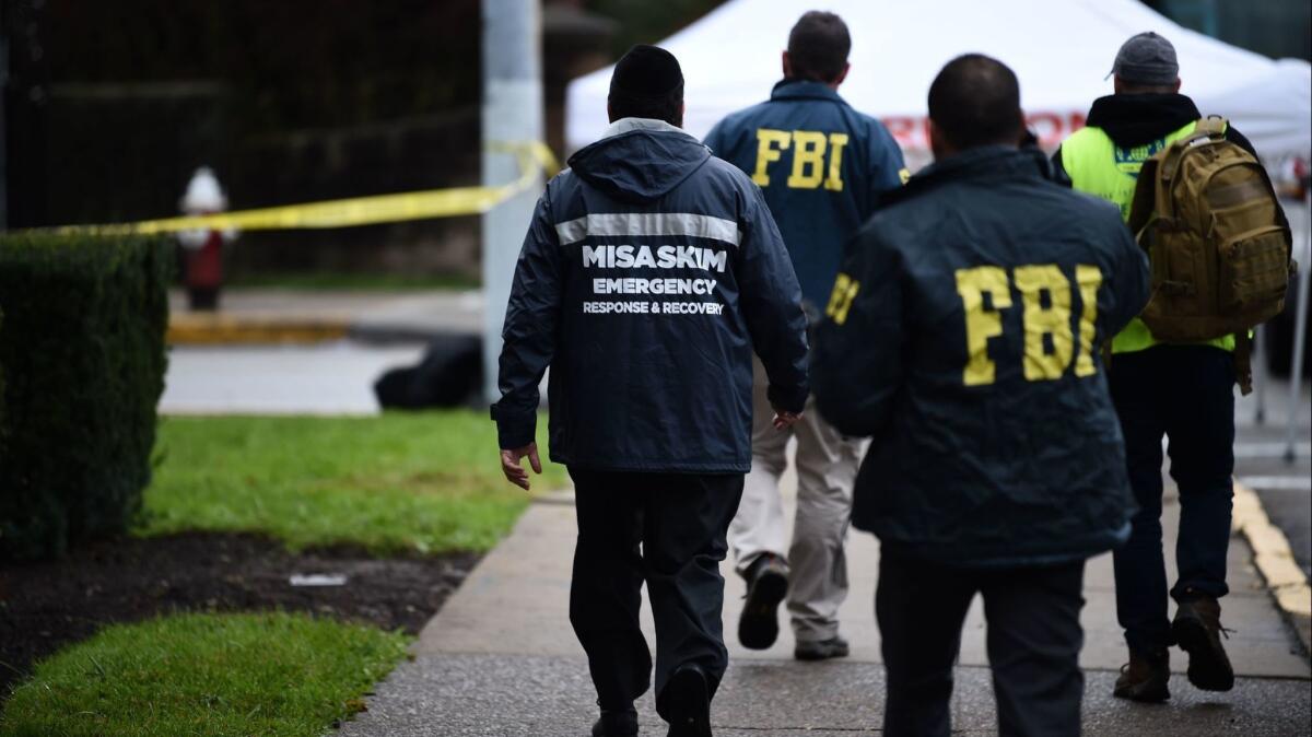 Members of the FBI continue to investigate the Tree of Life Synagogue in Pittsburgh on Sunday.