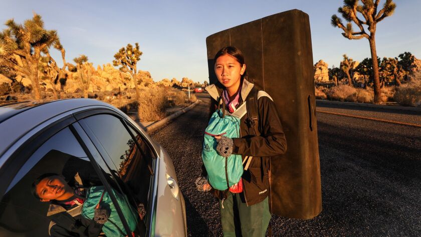 Jacelyn Kong, 21, from the San Gabriel Valley, arrives early Saturday morning at Joshua Tree National park to rock climb. “It's sad to see people destroy the parks,” she said.