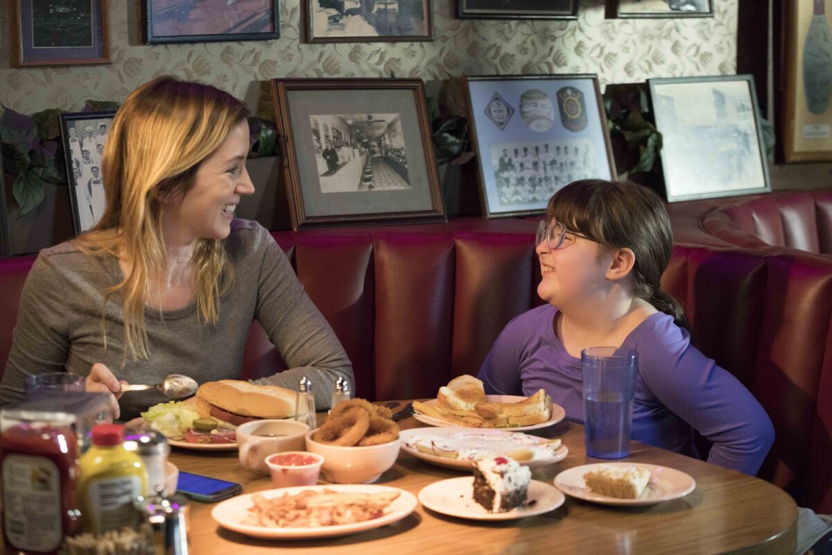Stephanie Turner and Daisy Prescott share a meal in the movie "Justine."