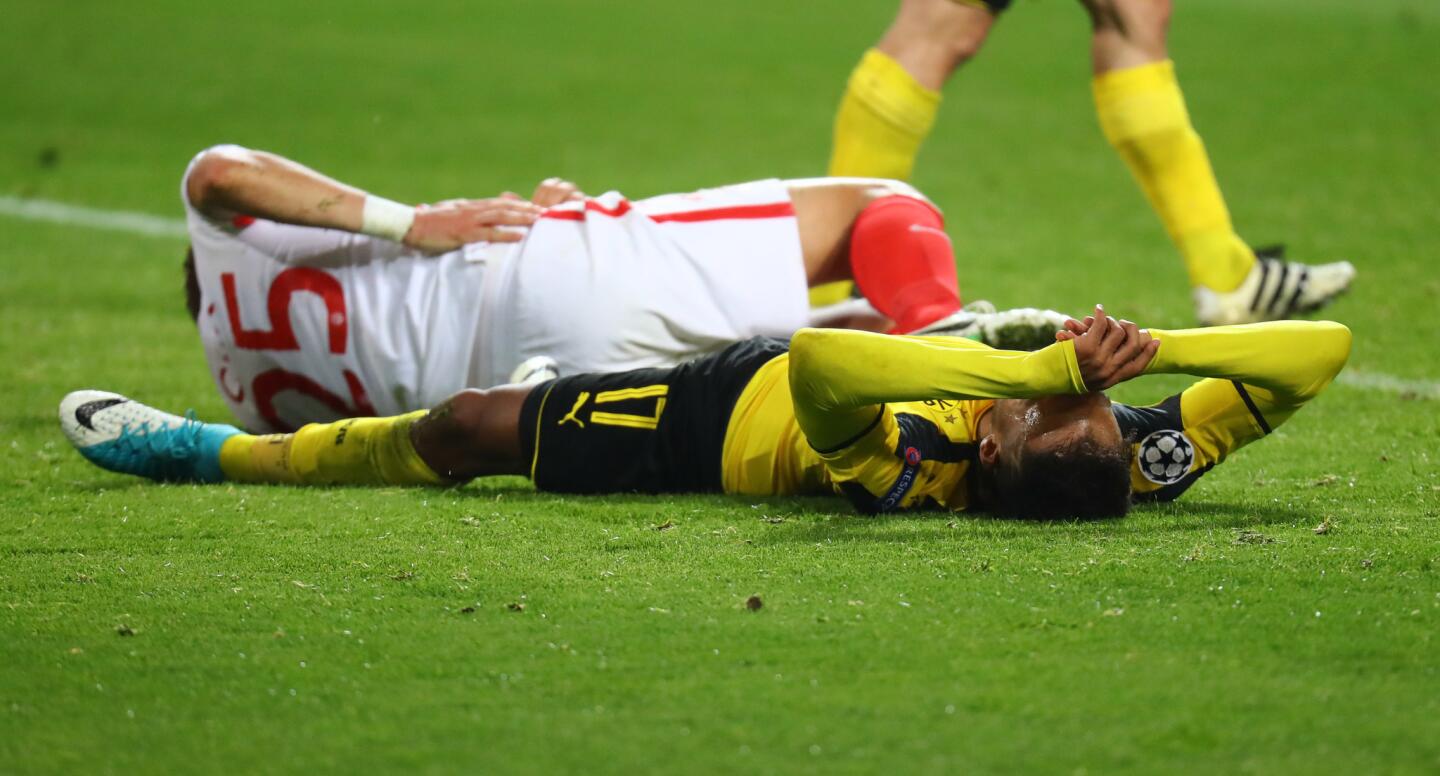 Borussia Dortmund's Pierre-Emerick Aubameyang after clashing with Monaco's Kamil Glik