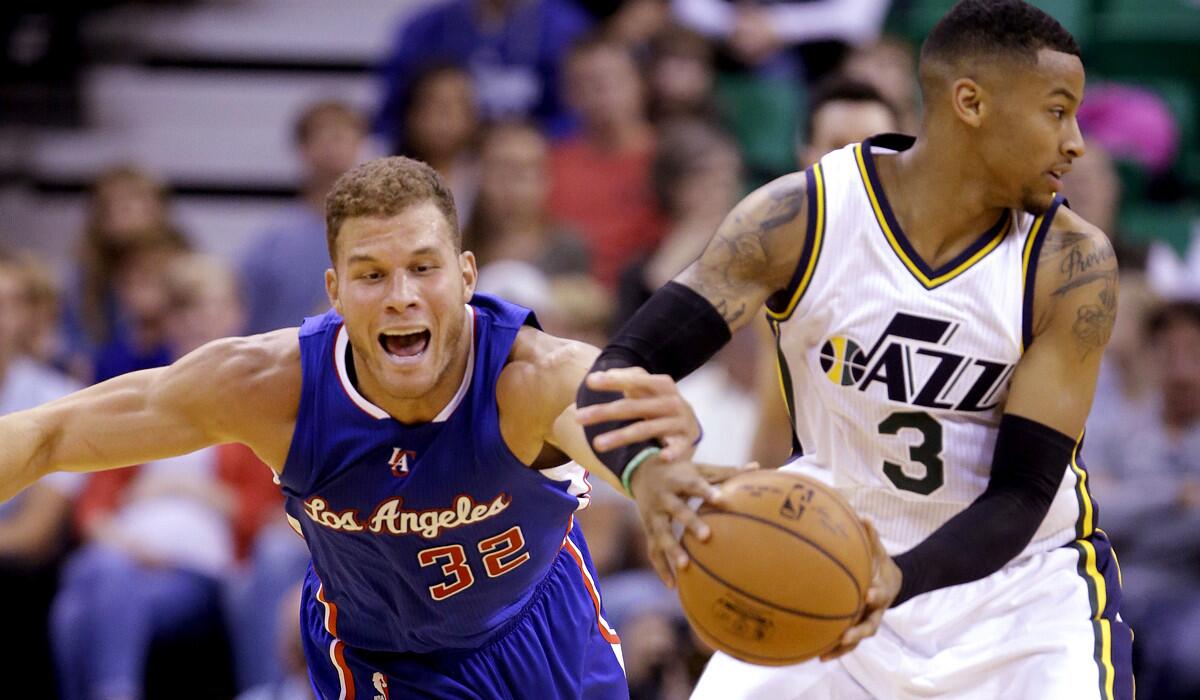 Clippers power forward Blake Griffin (32) attempts a steal against Jazz guard Trey Burke (3) in the second quarter Monday night in Salt Lake City.