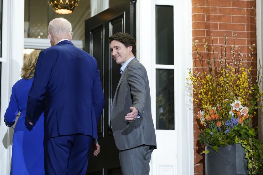 Canadian Prime Minister Justin Trudeau welcomes first lady Jill Biden and President Joe Biden at Rideau Cottage, Thursday, March 23, 2023, in Ottawa, Canada. (AP Photo/Andrew Harnik)