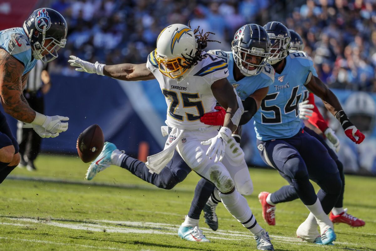 Chargers running back Melvin Gordon loses the ball during a game against the Titans on Oct. 20. 