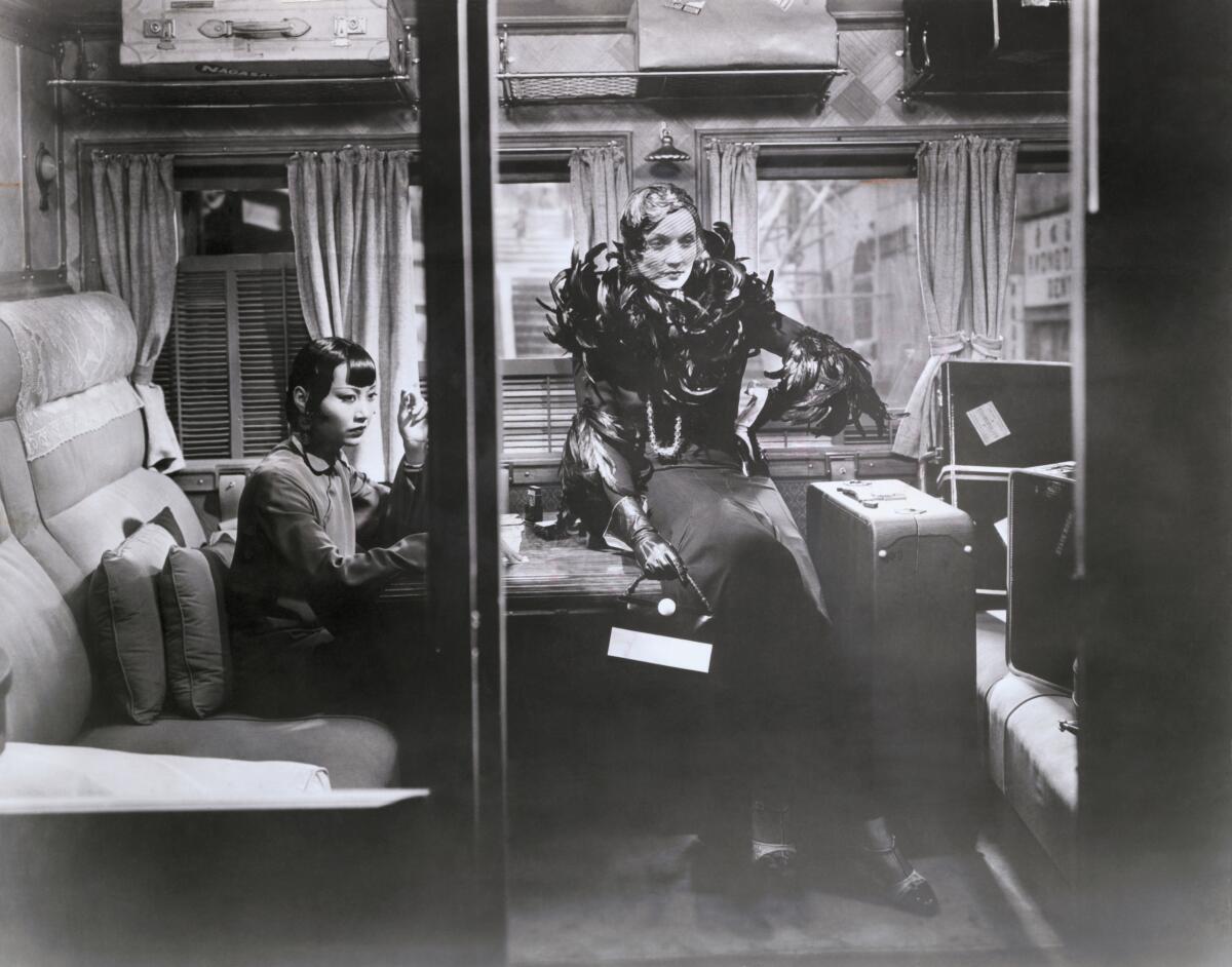 Two women in a train compartment 