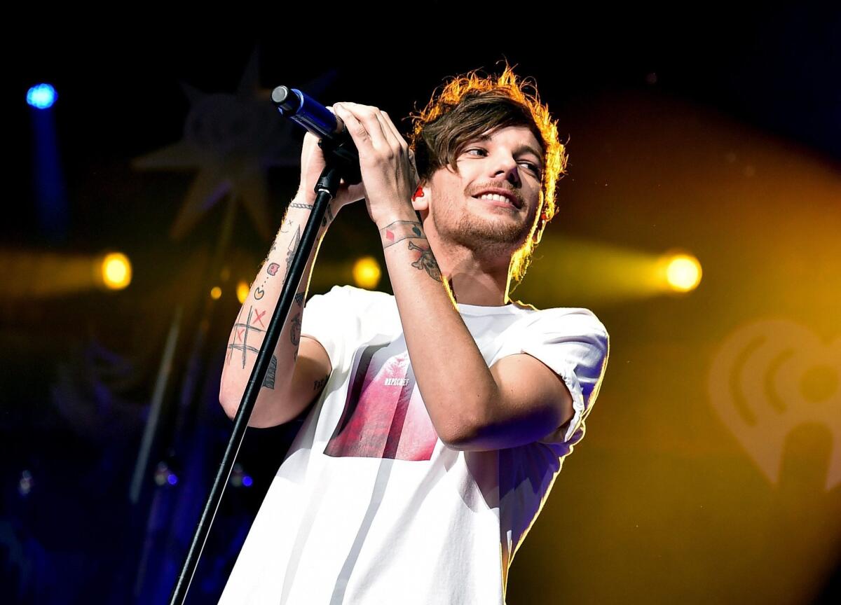 One Direction's Louis Tomlinson, seen here in December, has reportedly welcomed his first child.