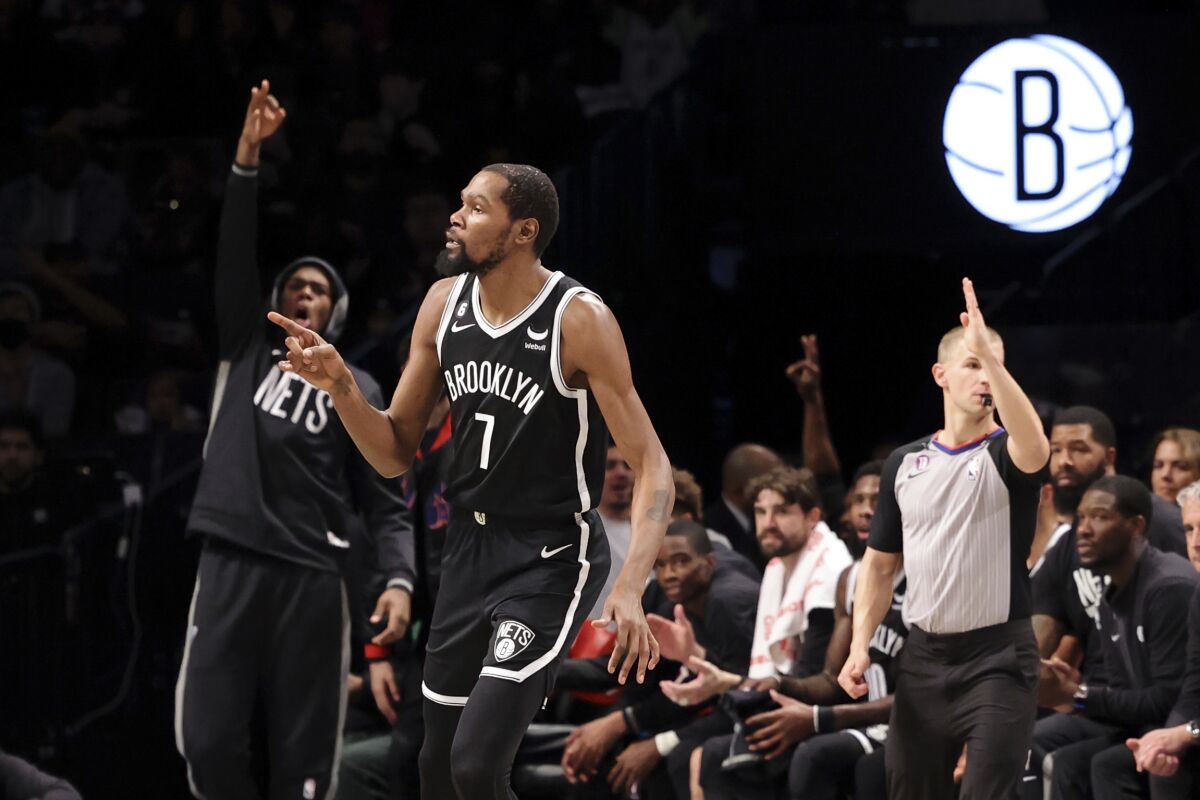 Brooklyn Nets forward Kevin Durant (7) reacts after scoring a 3-point shot against the Portland Trail Blazers during the first half of an NBA basketball game Sunday, Nov. 27, 2022, in New York. (AP Photo/Jessie Alcheh)