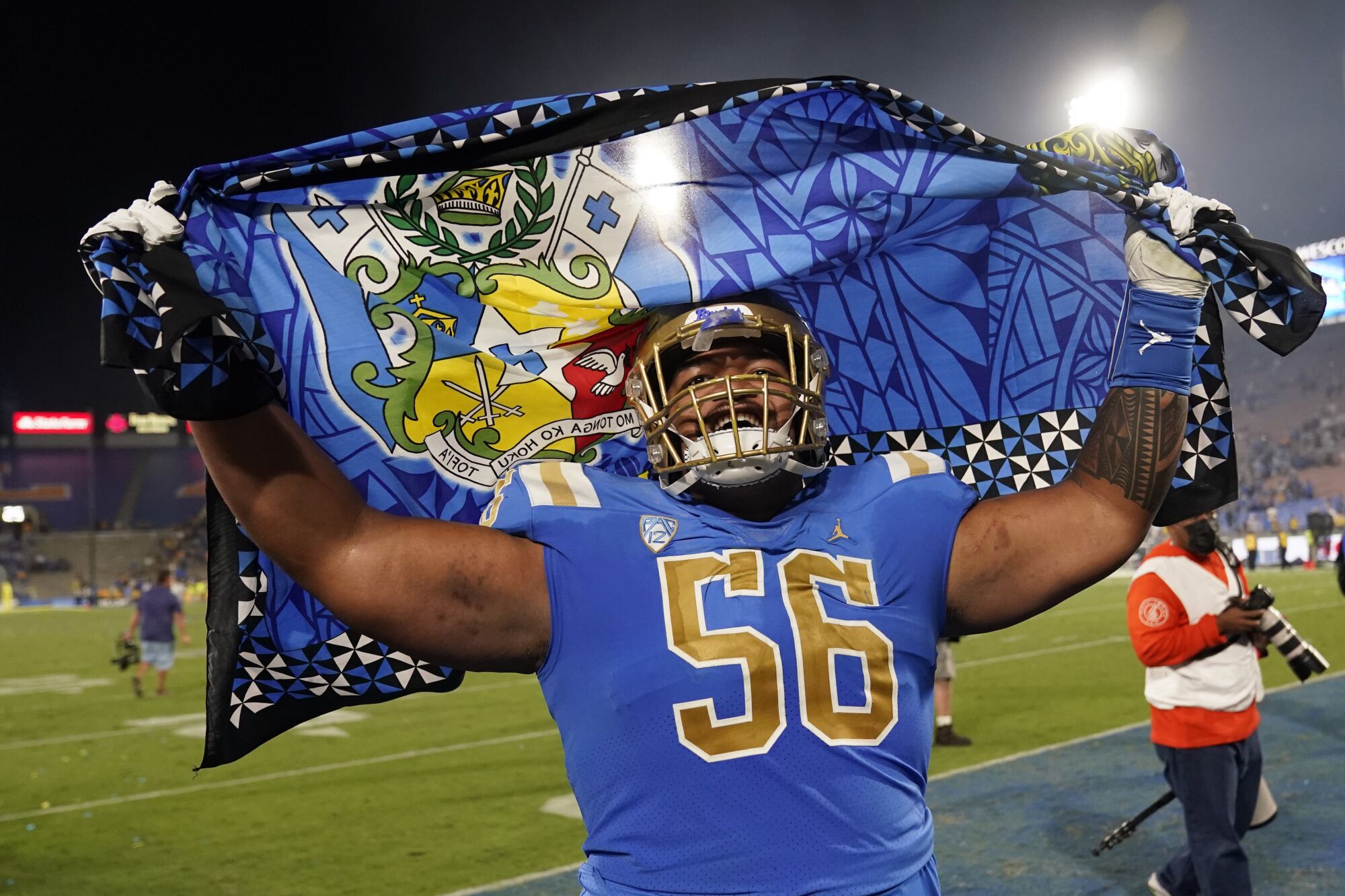 UCLA offensive lineman Atonio Mafi (56) celebrates the team's win over LSU.