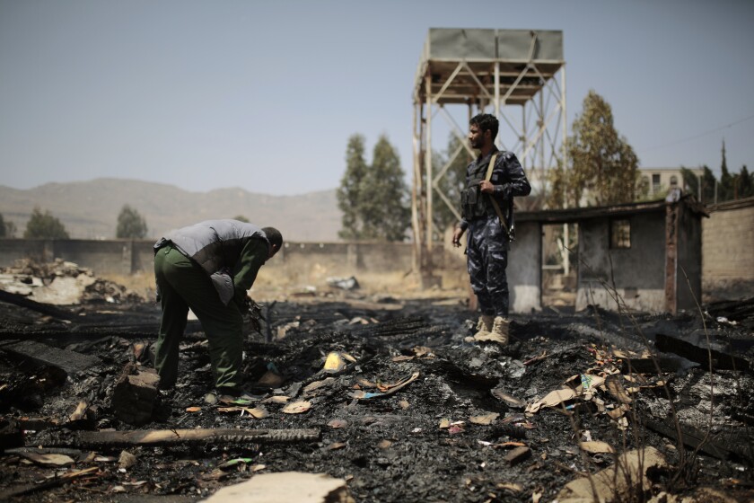 FILE - Yemeni police inspect a site of Saudi-led airstrikes targeting two houses in Sanaa, Yemen, Saturday, March 26, 2022. Yemen's warring sides have accepted a two-month truce, starting with the Muslim holy month of Ramadan, the U.N. envoy to Yemen said Friday, April 1. The envoy, Hans Grundberg, announced the agreement from Amman, Jordan, after meeting separately with both sides in the country's brutal civil war in recent days. He said that he hoped the truce would be renewed after two months. (AP Photo/Hani Mohammed, File)