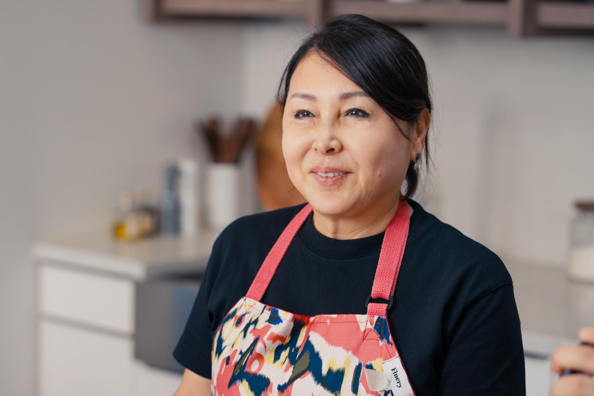 A photo of Jenee Kim in the LA Times test kitchen
