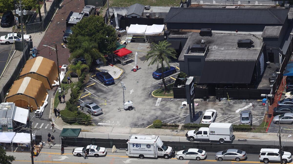 Law enforcement officials investigate the Pulse nightclub in Orlando, Fla., where Omar Mateen gunned down 49 people in June.