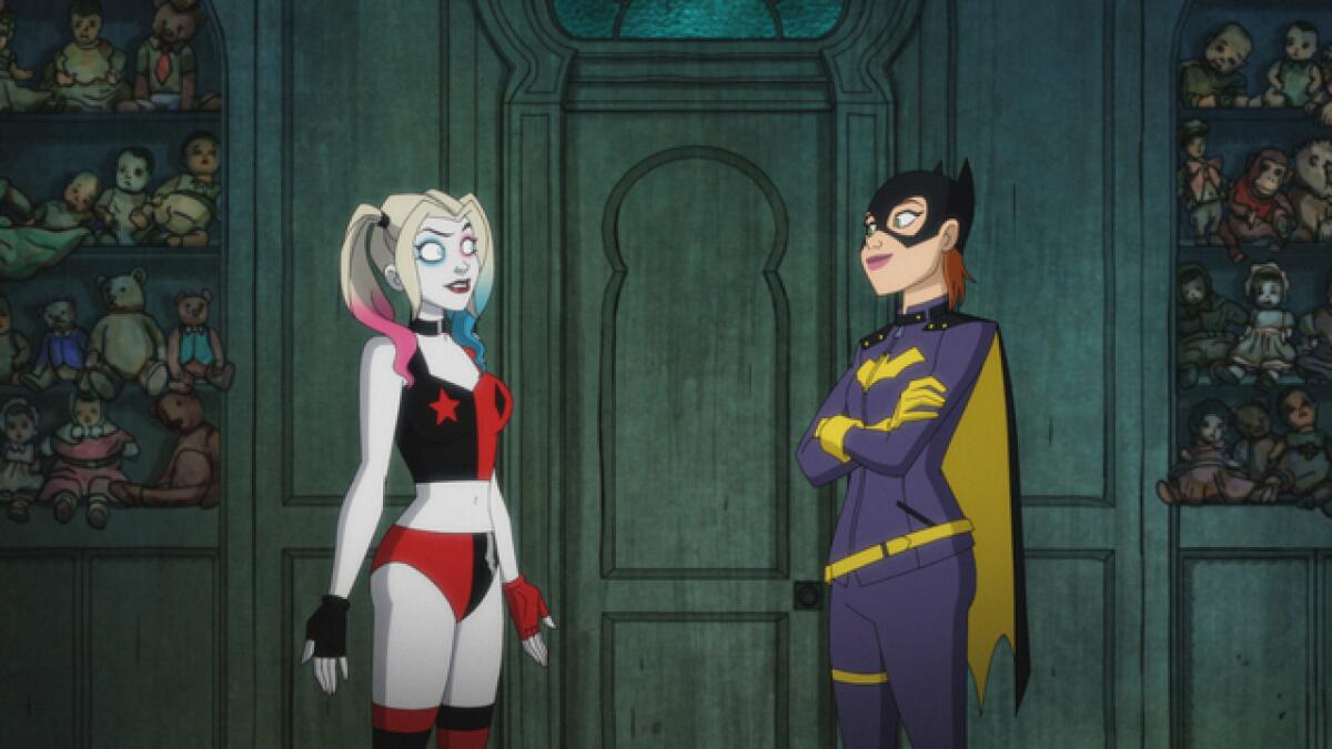 Two animated female superheroes standing in a darkened house
