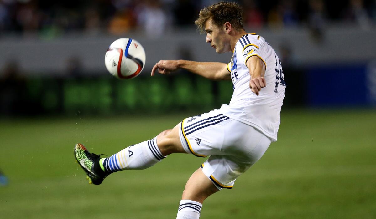 Galaxy midfielder Robbie Rogers clears the ball during a game against the Chicago Fire.