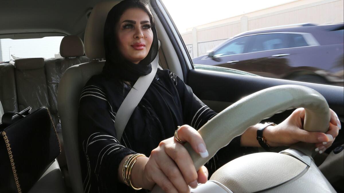 Huda Badri, 30, takes the wheel as decades-long ban on driving by women comes to an end in Saudi Arabia.